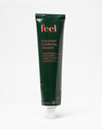 Green tube of 'feel' Enzymatic Exfoliating Cleanser on a white background