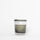 Candle in a glass jar with a white label on a white background