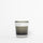 Candle with 'NETTE' label on a white background