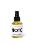 The Sunday Standard NOTO Agender Anywhere Oil in a clear glass pump bottle for body and hair conditioning.