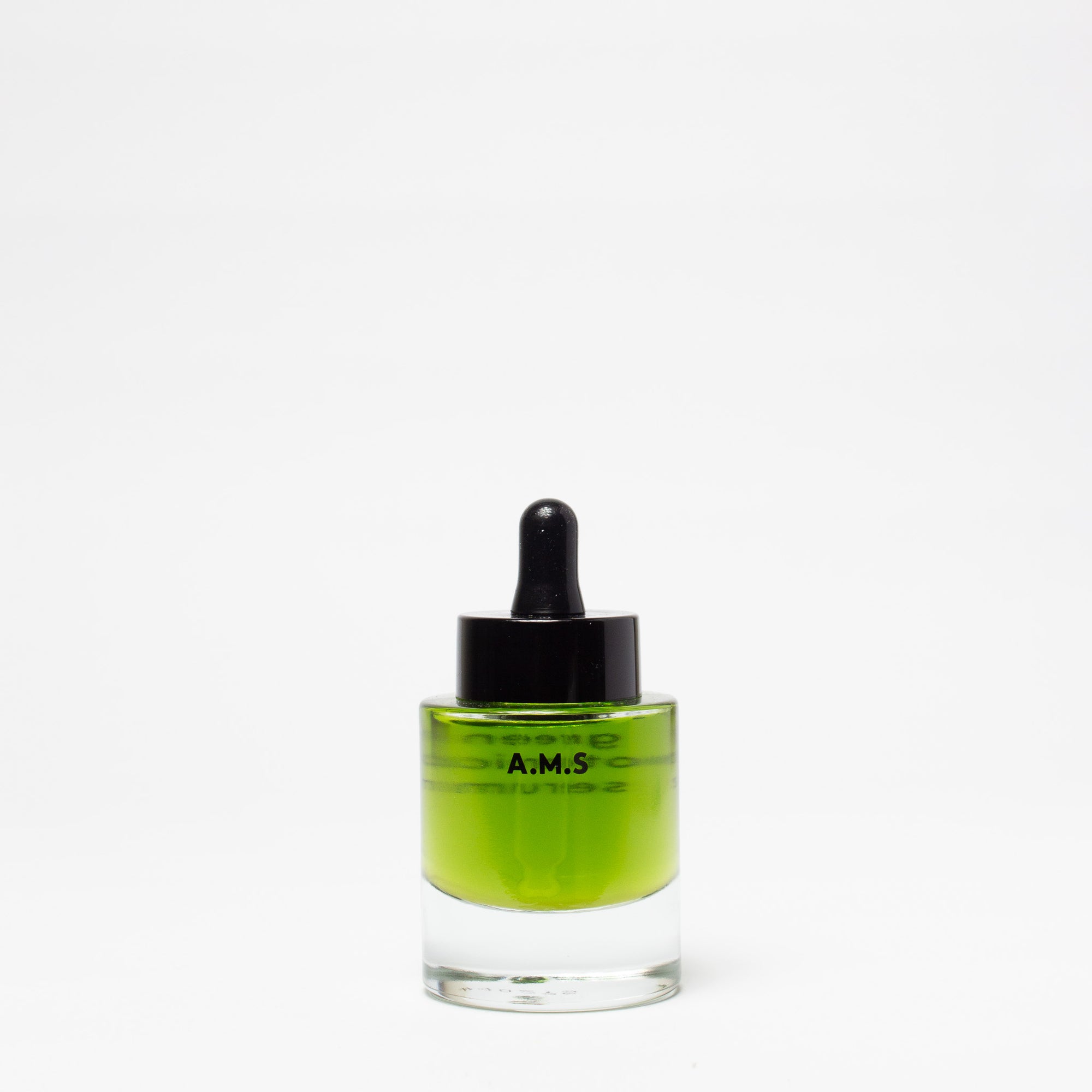 Glass dropper bottle with green liquid on a white background