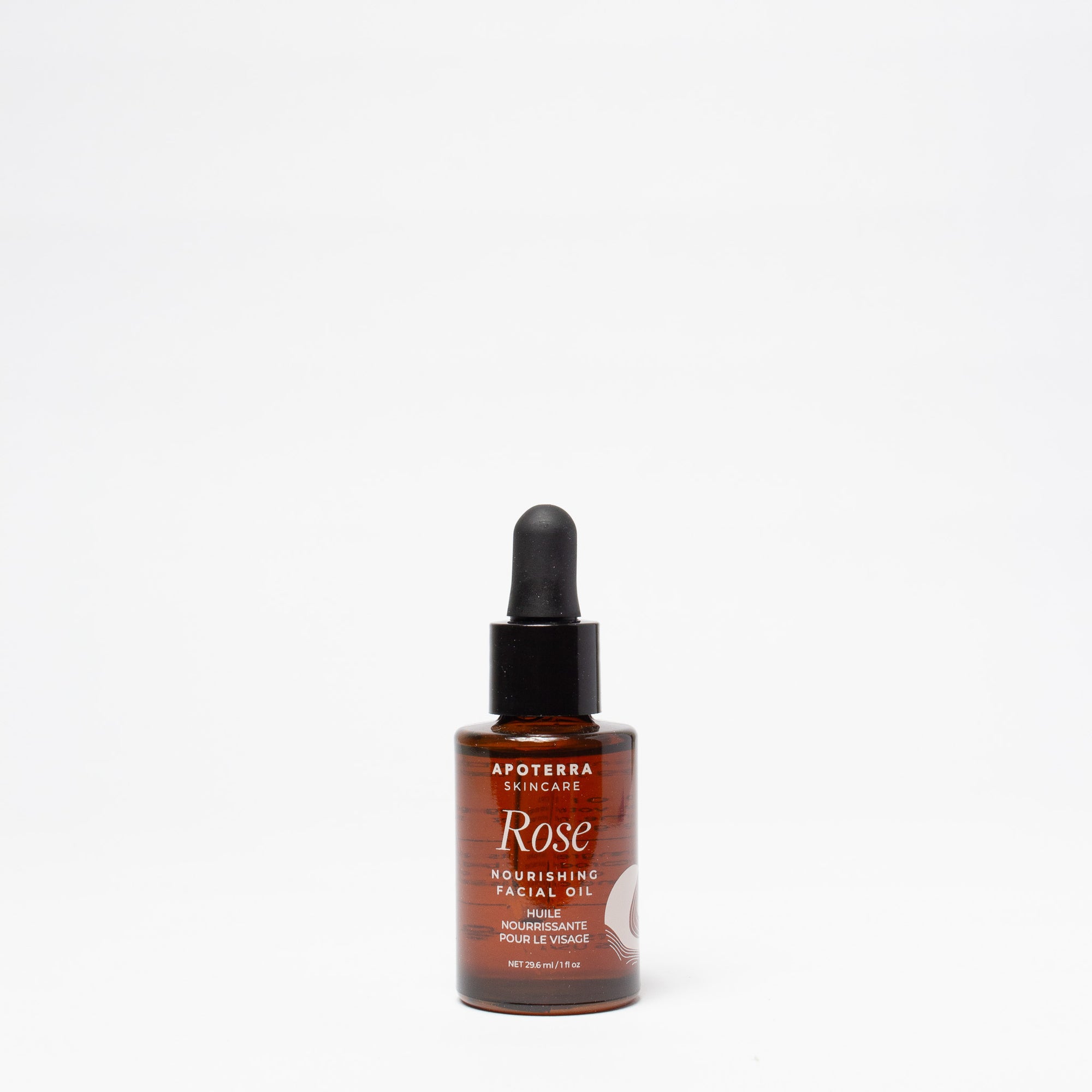 Rose nourishing facial oil bottle with dropper on a white background