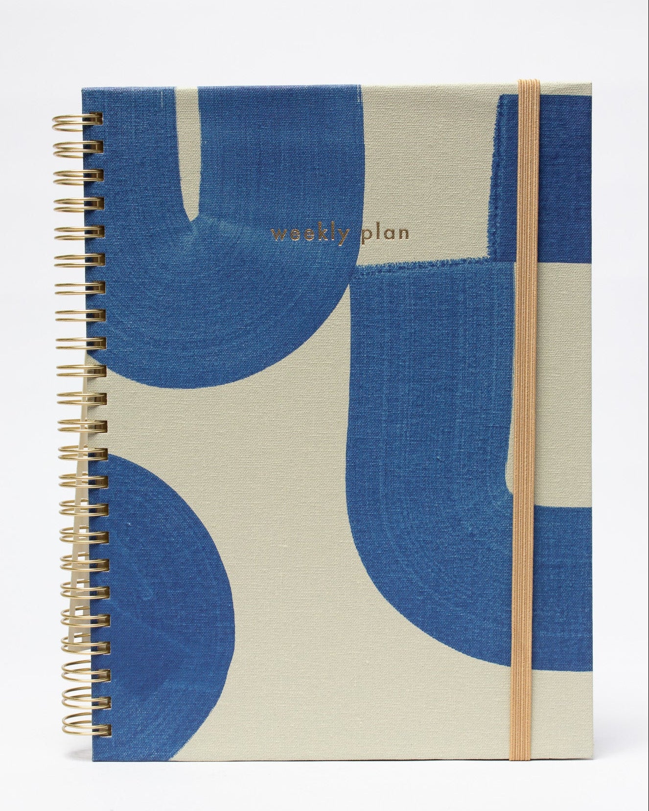 Notebook with blue and beige abstract design on a white background