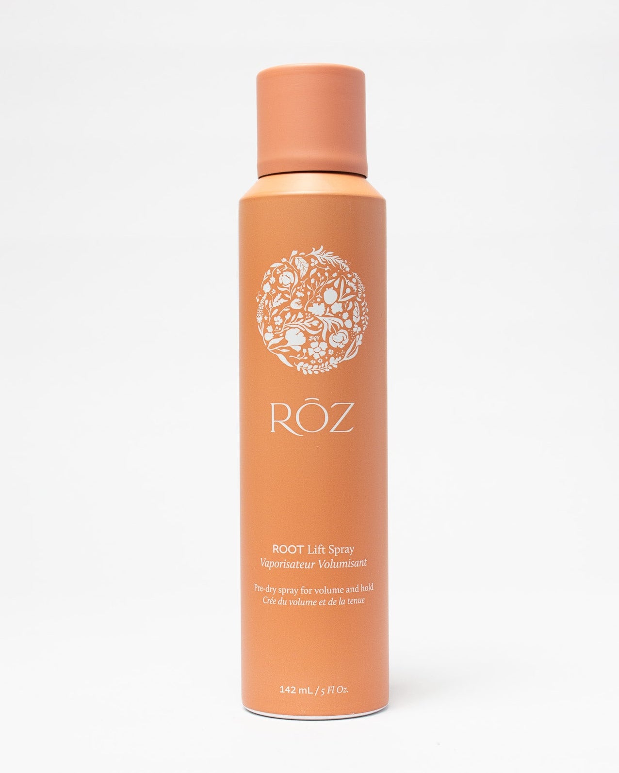 Orange bottle of Röz hair product on a white background