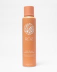 Orange bottle of Röz hair product on a white background