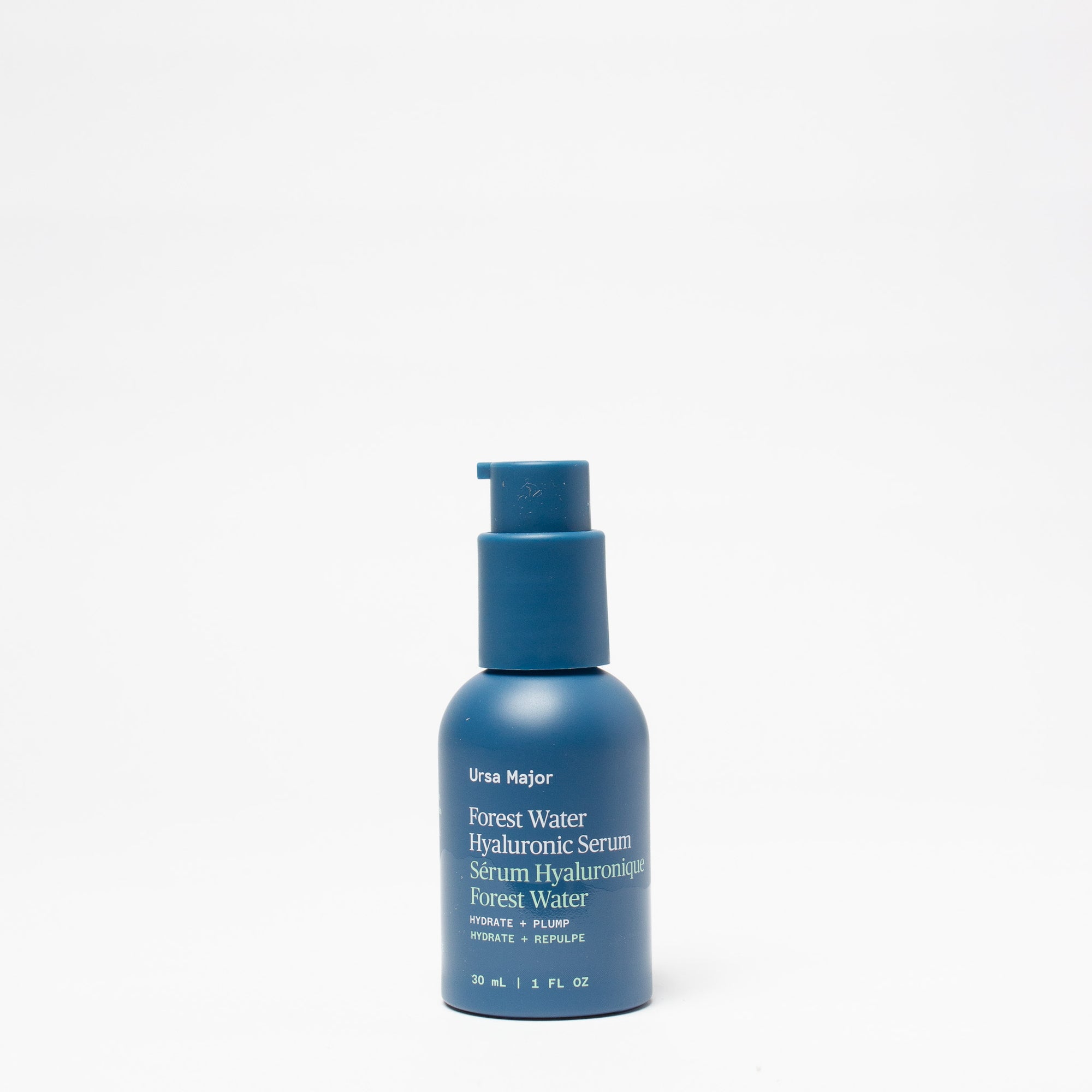 Blue bottle of Ursa Major Forest Water Hyaluronic Serum on a white background