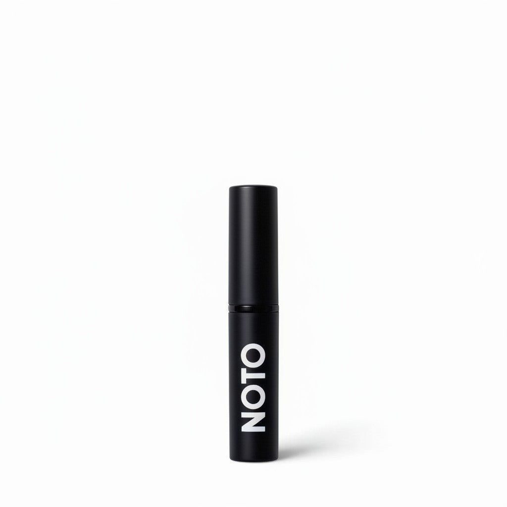 The Sunday Standard NOTO Multi-Bene berry lip and cheek stick in a sleek black aluminum tube.